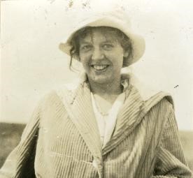 Portrait of Hilda Buckman-Crook, an artist, environmentalist, and poet, taken in 1920. She is dressed in period clothing and has a serene expression.